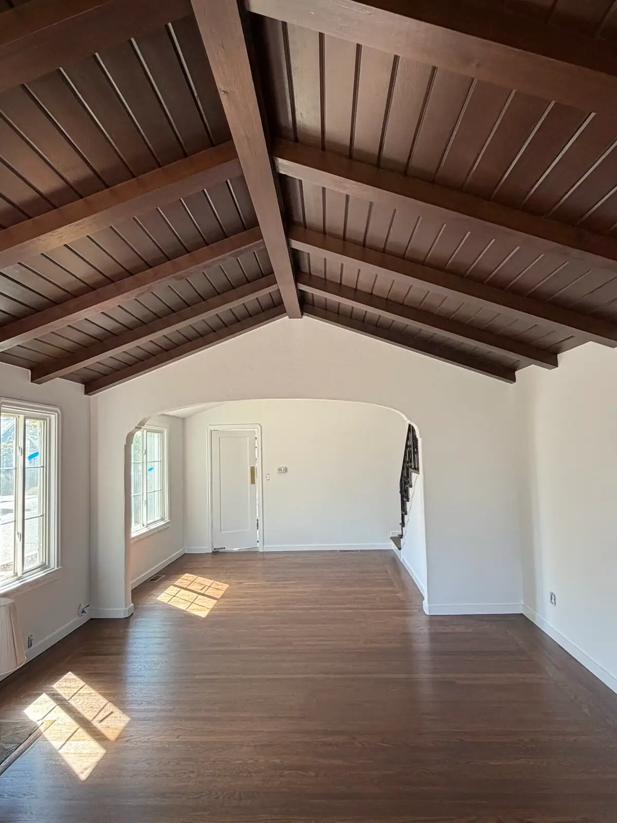 House painters in Alameda &mdash; interior repaint with refinished hardwood floors and wood-beam ceiling by Wilmar's Painting