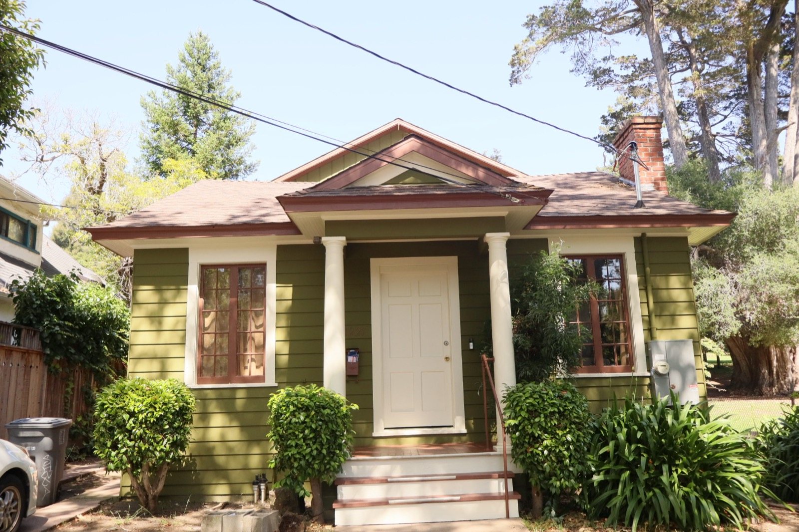 Olive bungalow with columns, exterior repaint