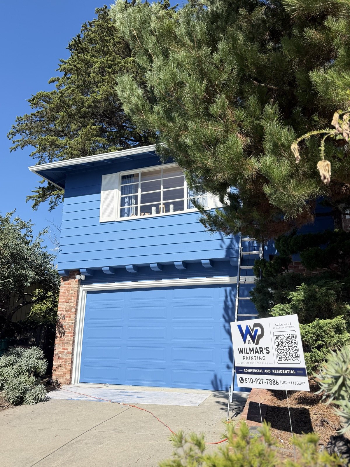 Blue home with garage, exterior repaint