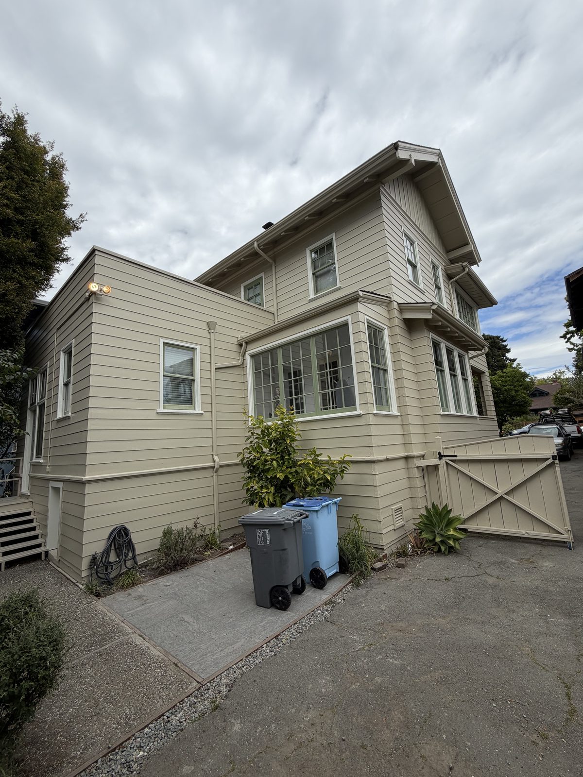 Two-story East Bay home with a freshly painted olive green exterior by Wilmar's Painting
