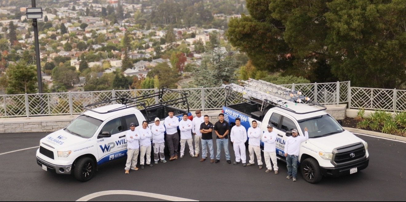The Wilmar&rsquo;s Painting crew and company trucks in Oakland
